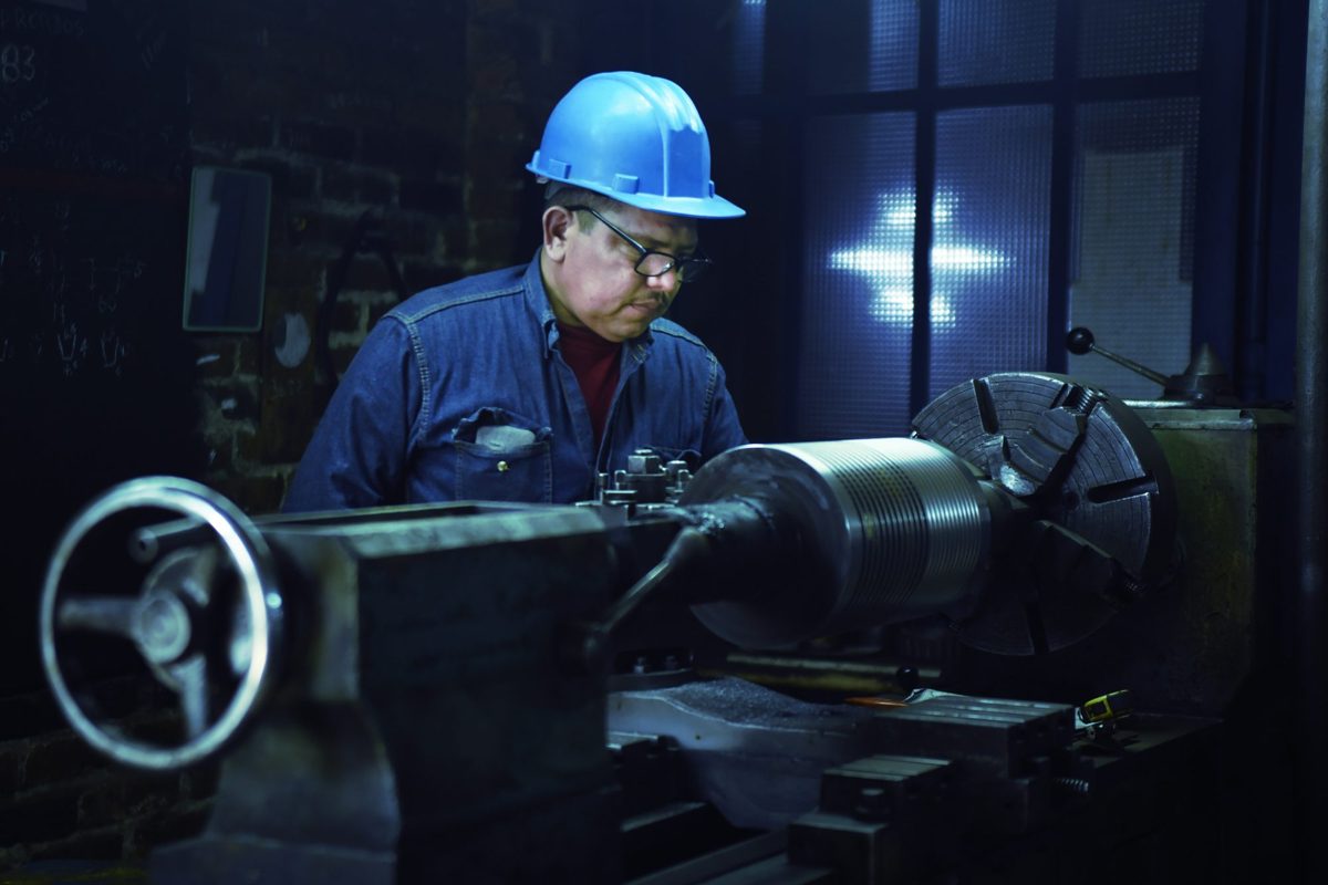 Local trainee at a lathe