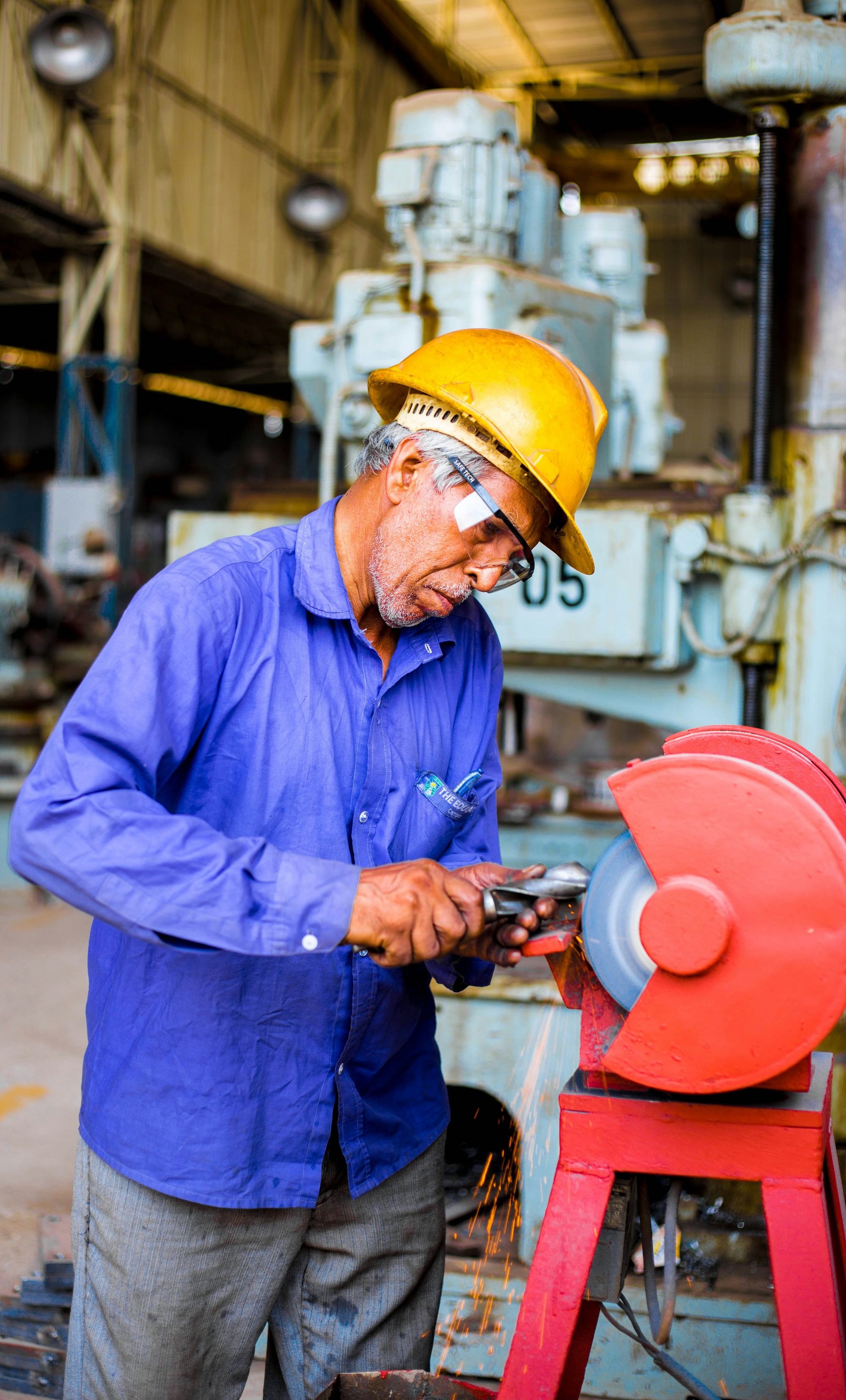 Operator dressing a steel casting in the fettling bay